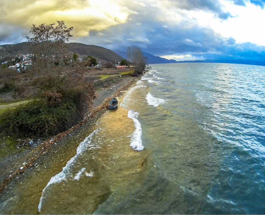 Aeriall photography - old boat stranded on the shore of the Ohrid lake